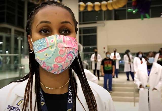 Black female doctor in face mask